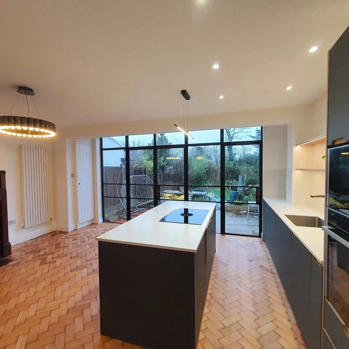 Rear extension: kitchen island and black-framed glass doors