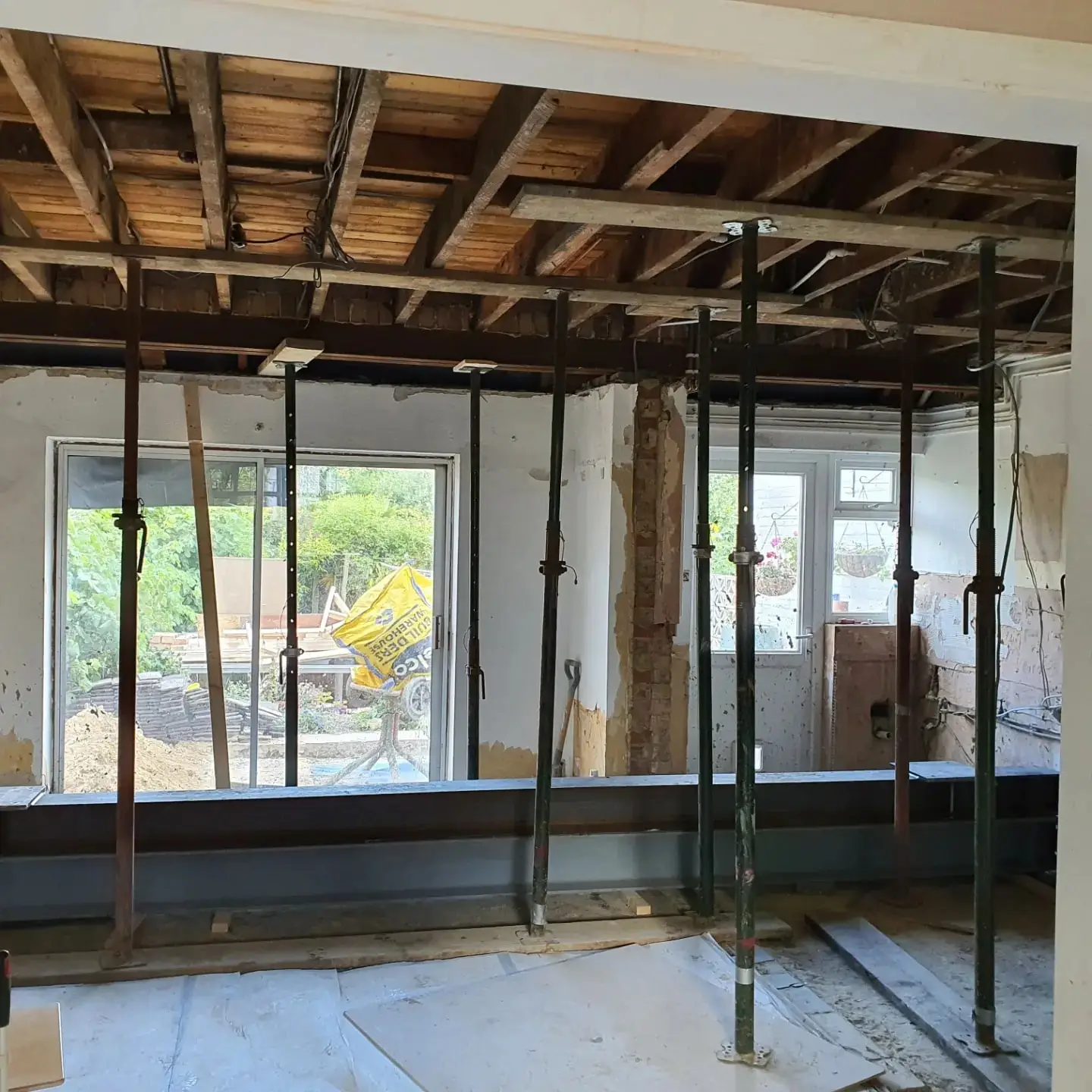 Back wall propped with acrow props before the steel beam goes in