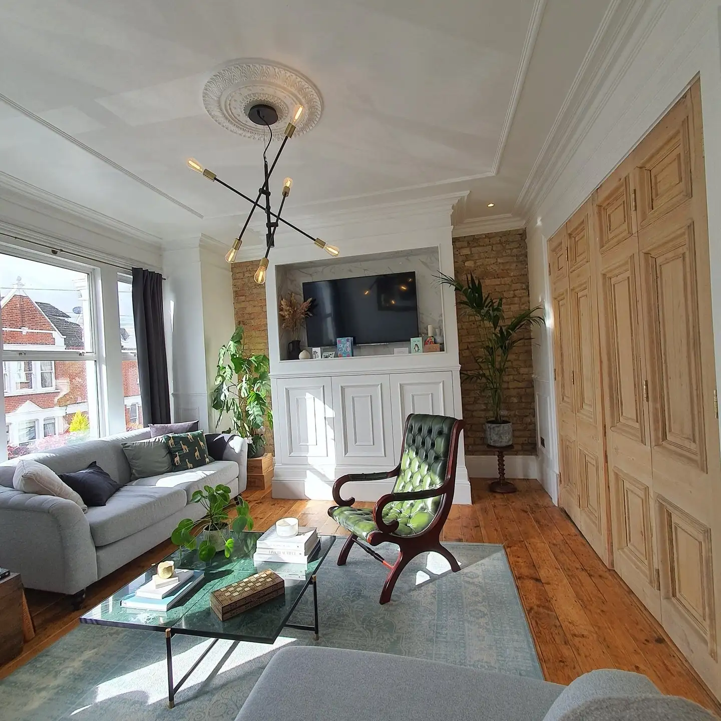 Refurbished flat: living room with restored doors