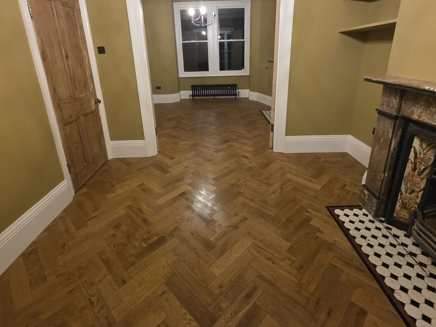 Herringbone floor running through from the back room to the front room